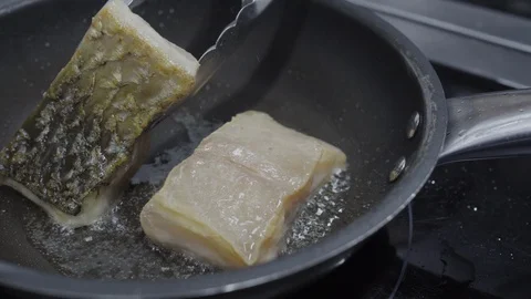 Fried fish in a pan Stock Footage 121881139