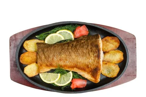 Fried fish in the pan, on a white background 写真素材