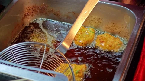 Fried fish-paste balls and fried basil leaves. Stock Footage 306924346