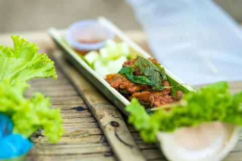 Fried fish-paste balls fish on wood plate from bamboo tree Stock Photos
