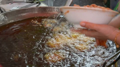 Fried fish patty is fried in boiling oil. Stock Footage 85899149
