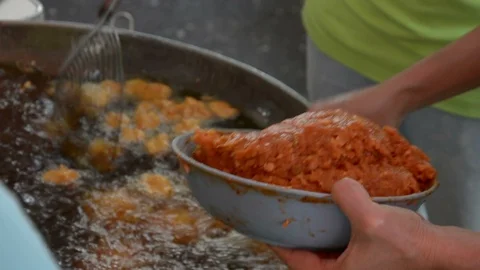 Fried fish patty is fried in boiling oil. Stock Footage 85899279