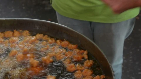 Fried fish patty is fried in boiling oil. Stock Footage 85899549