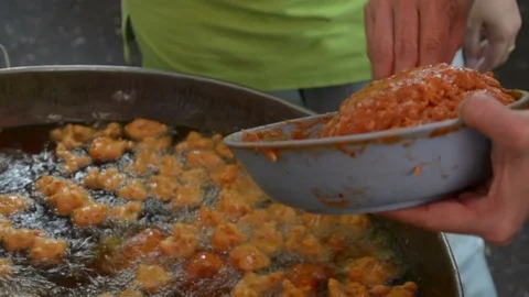 Fried fish patty is fried in boiling oil. Stock Footage 85900926
