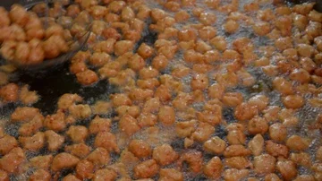 Fried fish patty is fried in boiling oil. Stock Footage 85905533