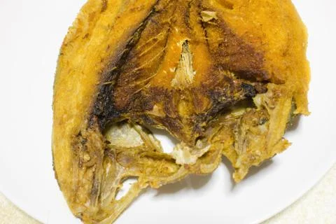 Fried fish on a plate Stock Photos