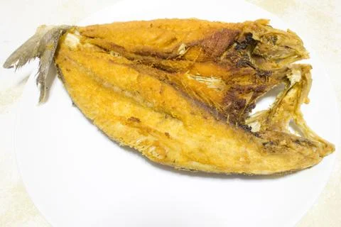Fried fish on a plate Stock Photos