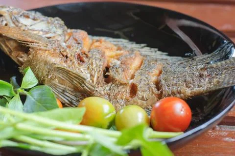 Fried fish in plate Stock Photos
