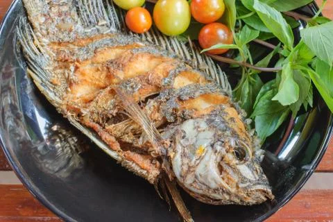 Fried fish in plate Stock Photos