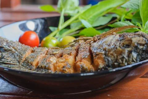 Fried fish in plate Stock Photos
