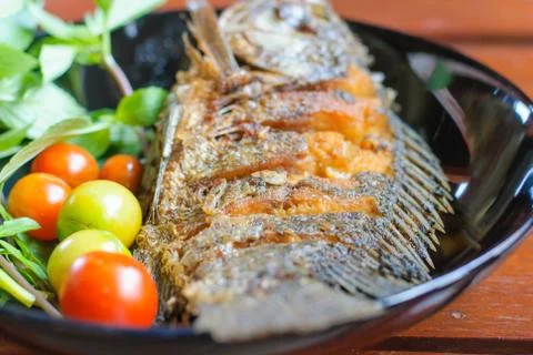 Fried fish in plate Stock Photos