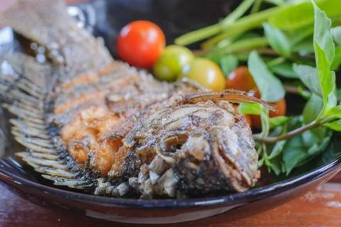 Fried fish in plate Stock Photos