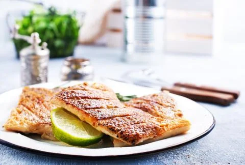 Fried fish on plate Stock Photos