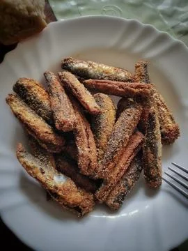 Fried Fish on a Plate at the Table 写真素材