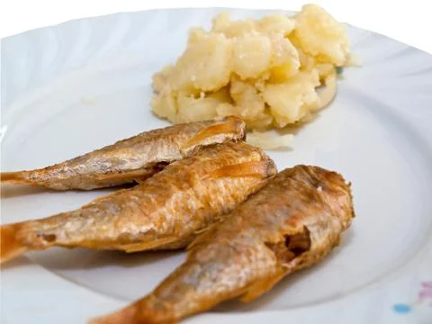 Fried fish with potatoes Фото