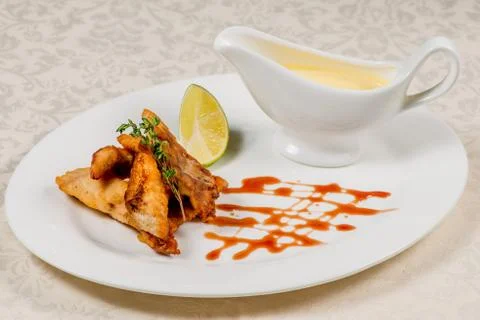 Fried fish with sauce Stock Photos