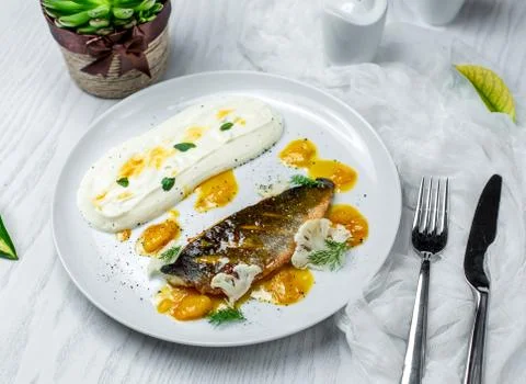 Fried fish served with yoghurt Stock Photos