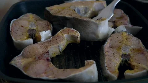 Fried fish steaks in pan. Timelapse speed up Stock Footage 49852402