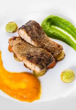 Fried fish with vegetables Stock Photos