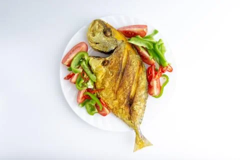 Fried fish on white background with selective focus Stock Photos