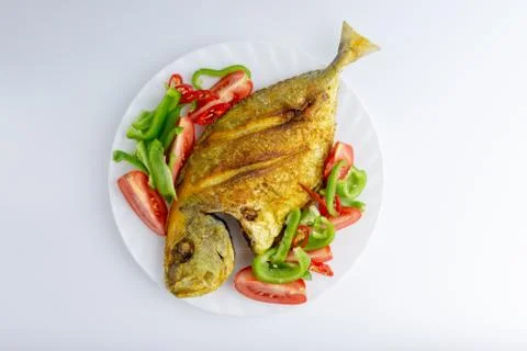 Fried fish on white background with selective focus 스톡 사진