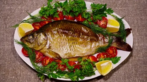 Fried fish on a white plate - stop motion animation Stock Footage 71771389