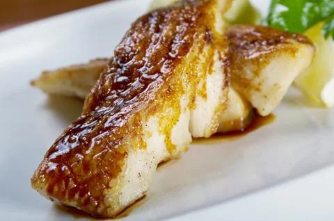 Fried in flour codfish Stock Photos