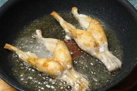 Fried frog thighs Stock Photos