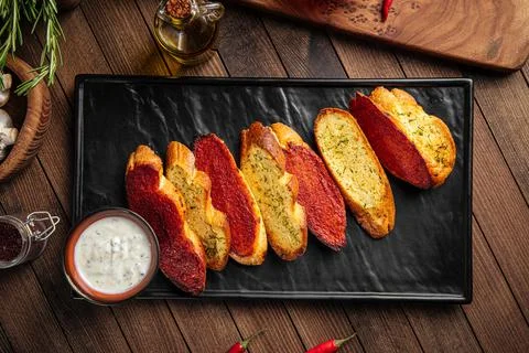 Fried garlic bread appetizer with sauce Stock Photos