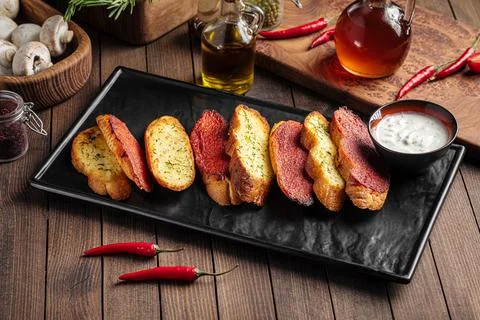 Fried garlic bread appetizer with sauce Stock Photos
