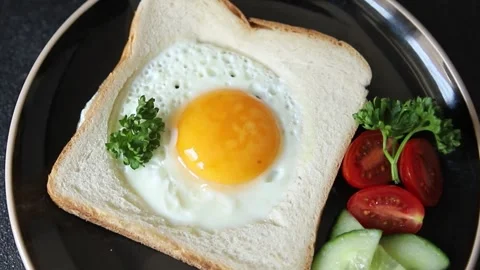 Fried gashouse eggs in bread egg in the basket delicious snack Stock Footage 309203296