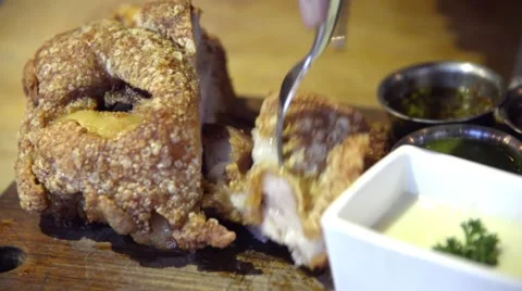 Fried German pork knuckle (eisbein) eating Stock Footage 63303044