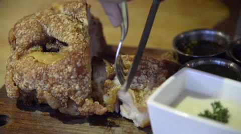 Fried German pork knuckle (eisbein) sliced with knife closeup time-lapse Stock Footage 63351155