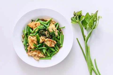Fried green vegetable with egg. Stock Photos