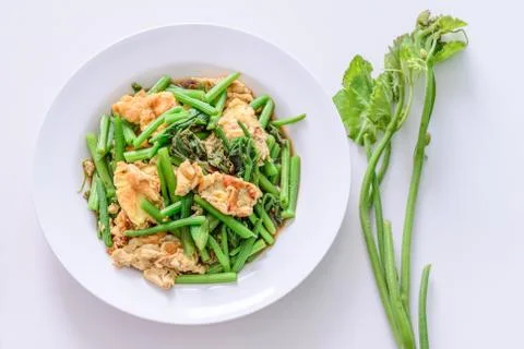 Fried green vegetable with egg. Stock Photos
