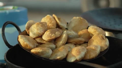 Fried kachori or Shell Snacks Close Up in Market Stock Footage 320363028
