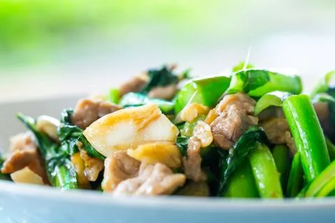 Fried kale with pork Stock Photos