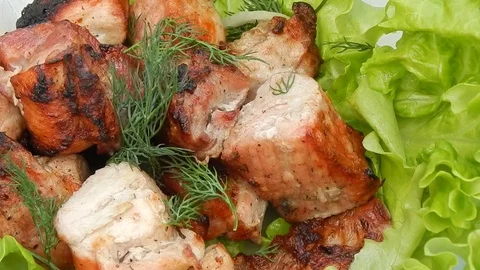Fried kebab with lettuce close-up Stock Footage 76774879