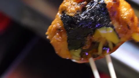 Fried Korean Fish Cake Skewer Wrapped in Nori Seaweed Stock Footage 337374541