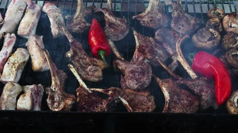 Fried lamb ribs on the grill. Fragrant fried meat. Red pepper on the grill. frie Stock Footage 201818182