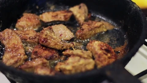 Fried liver in a frying pan Stock Footage