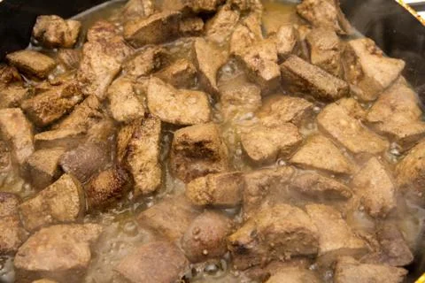 Fried liver in a pan Stock Photos