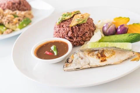 Fried mackerel with shrimp paste sauce and berry rice Stock Photos