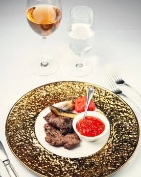 Fried meat with adjika Stock Photos