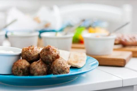 Fried meat balls with mint and apple with white sauce and flat cakes Stock Photos