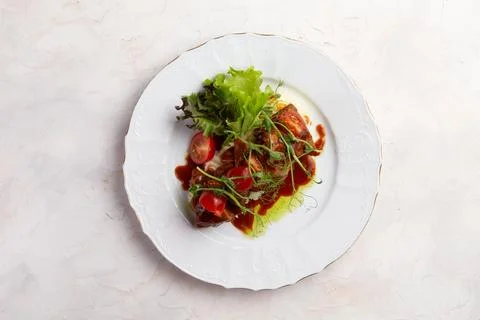 Fried meat on a bed of mashed potatoes. Stock Photos