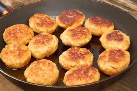 Fried meat cutlets on a pan Stock Photos