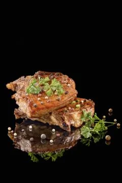 Fried meat on the fork with pepper Stock Photos