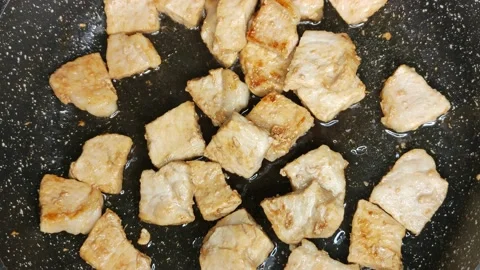 Fried meat in a frying pan Stock Footage 168912462