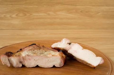 Fried meat on a grill. Stock Photos